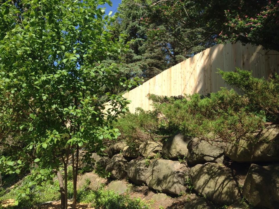 Uphill wood privacy fence